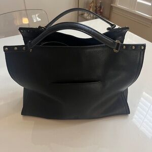 Square leather bag with studs detail